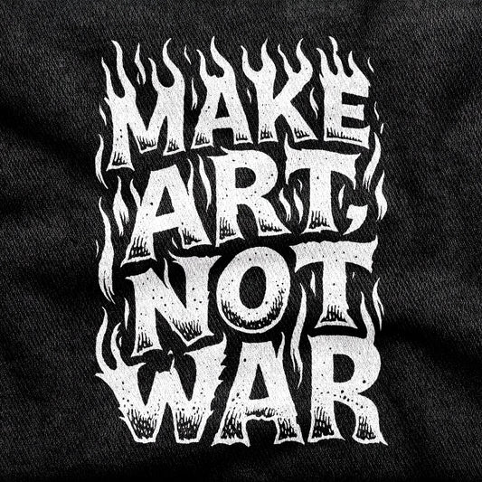 Make Art Not War design printed on a black cotton tee, close-up