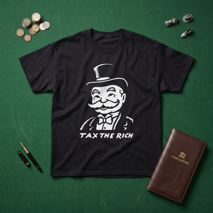 Tax the Rich black graphic tee, styled flat lay