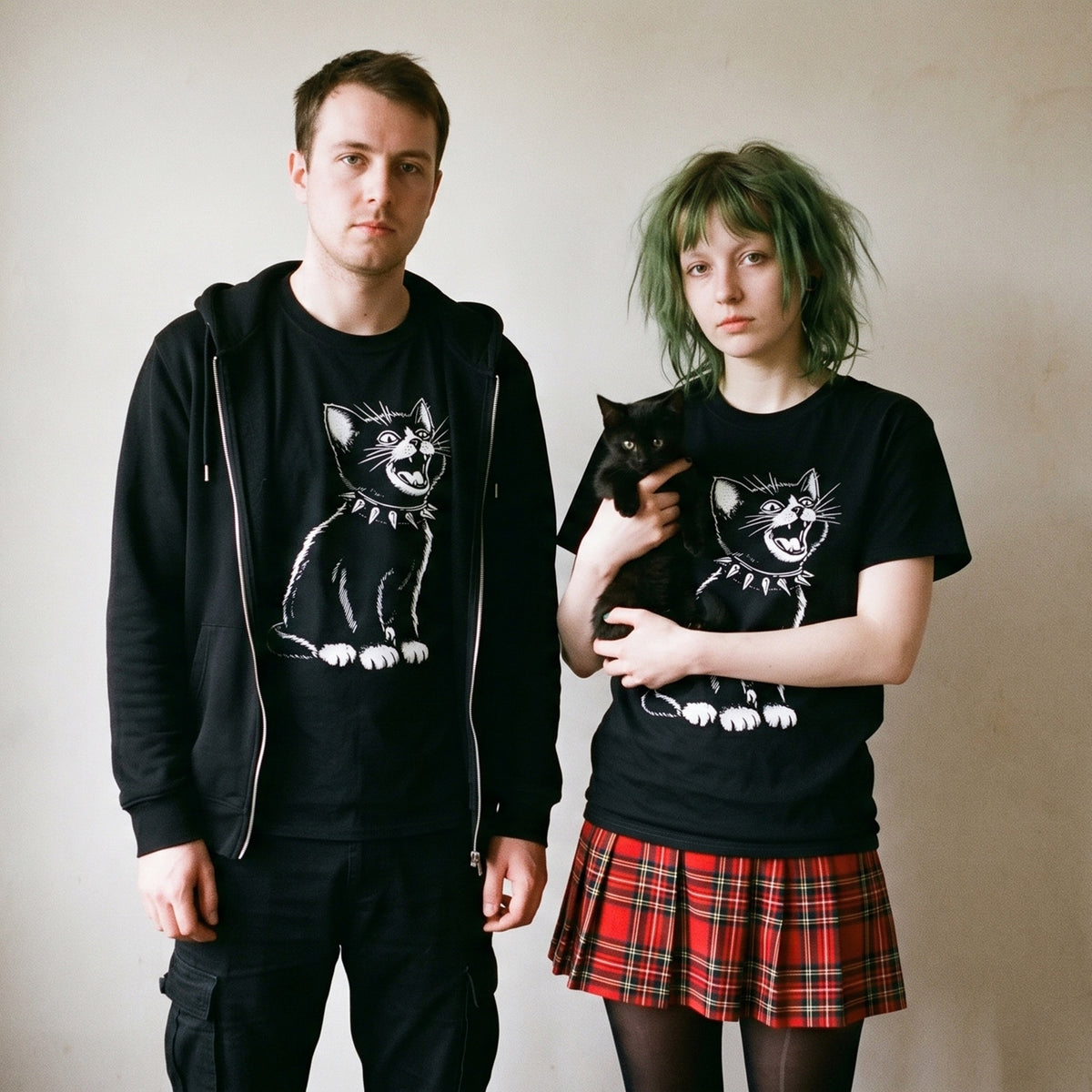 Two models wearing the Kittenpunk black graphic tee