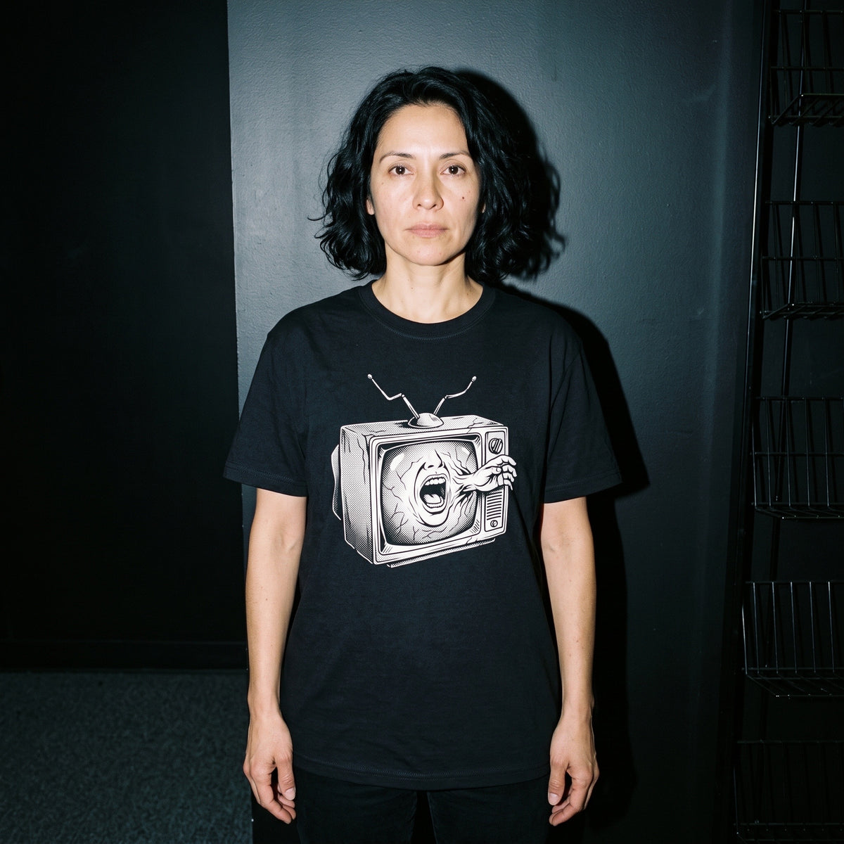 Woman wearing the Videodrome black graphic tee