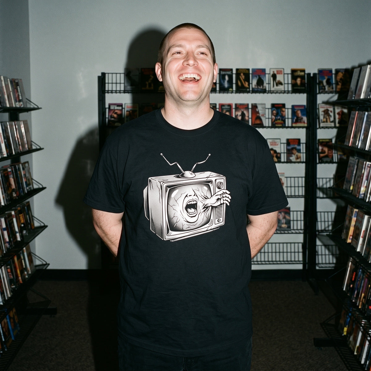 Man wearing the Videodrome black graphic tee