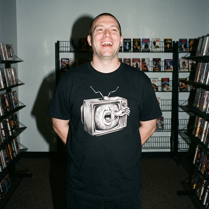 Man wearing the Videodrome black graphic tee