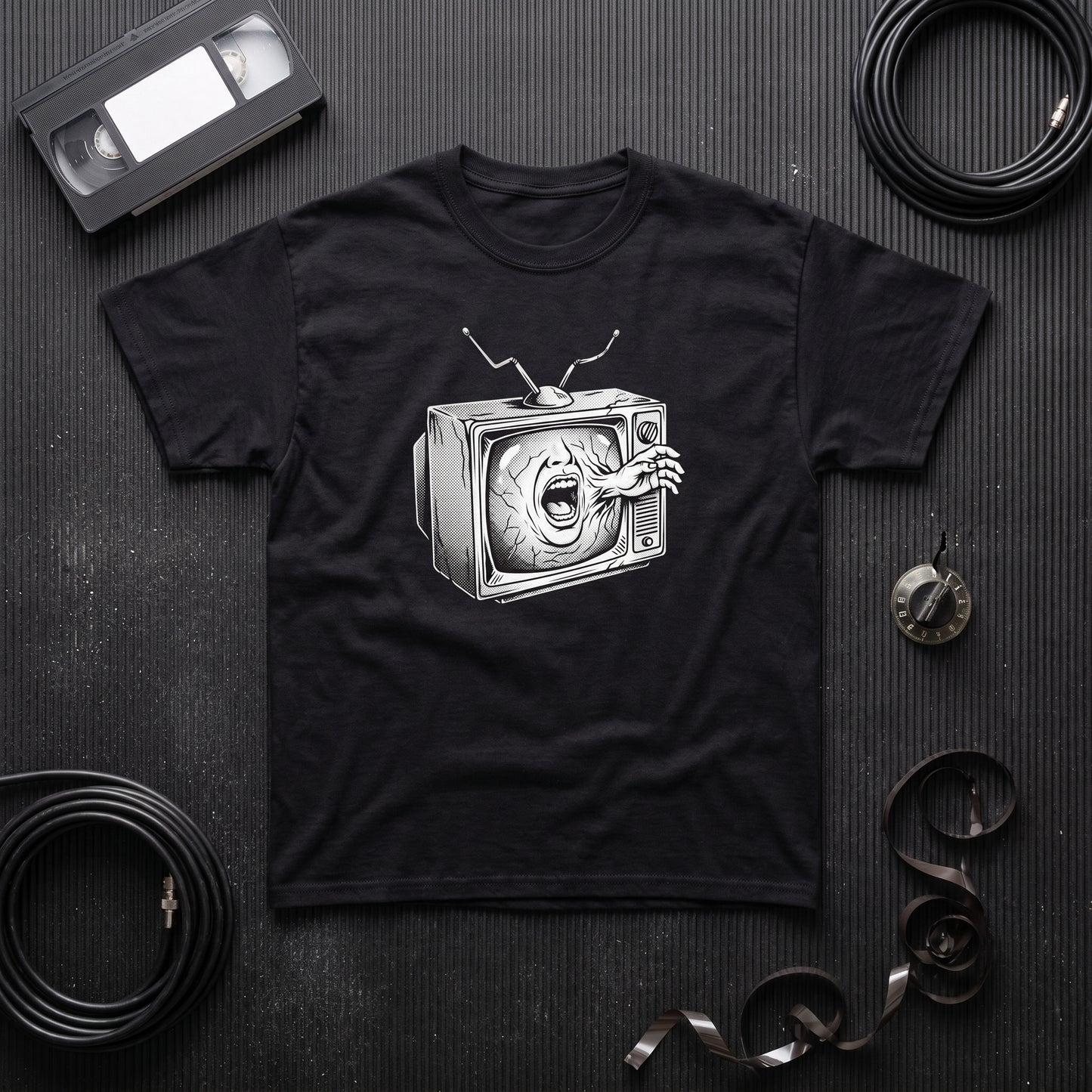 Videodrome black graphic tee, styled flat lay