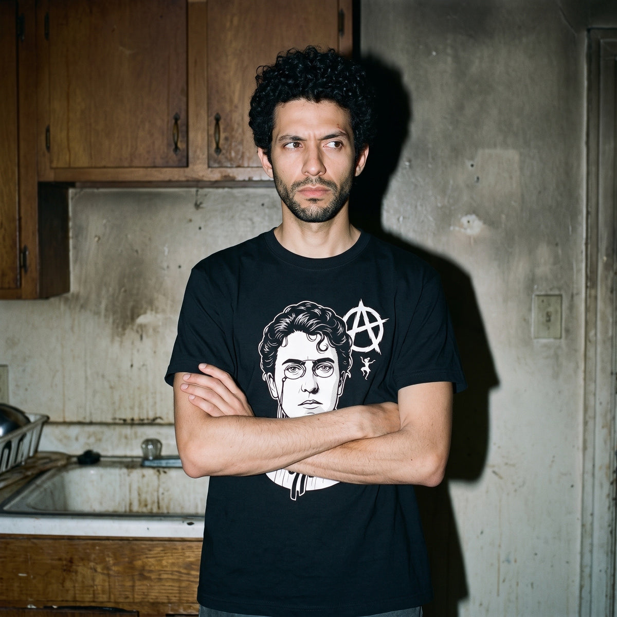 Man wearing the Emma Goldman black graphic tee