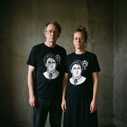 Two models wearing the Emma Goldman black graphic tee