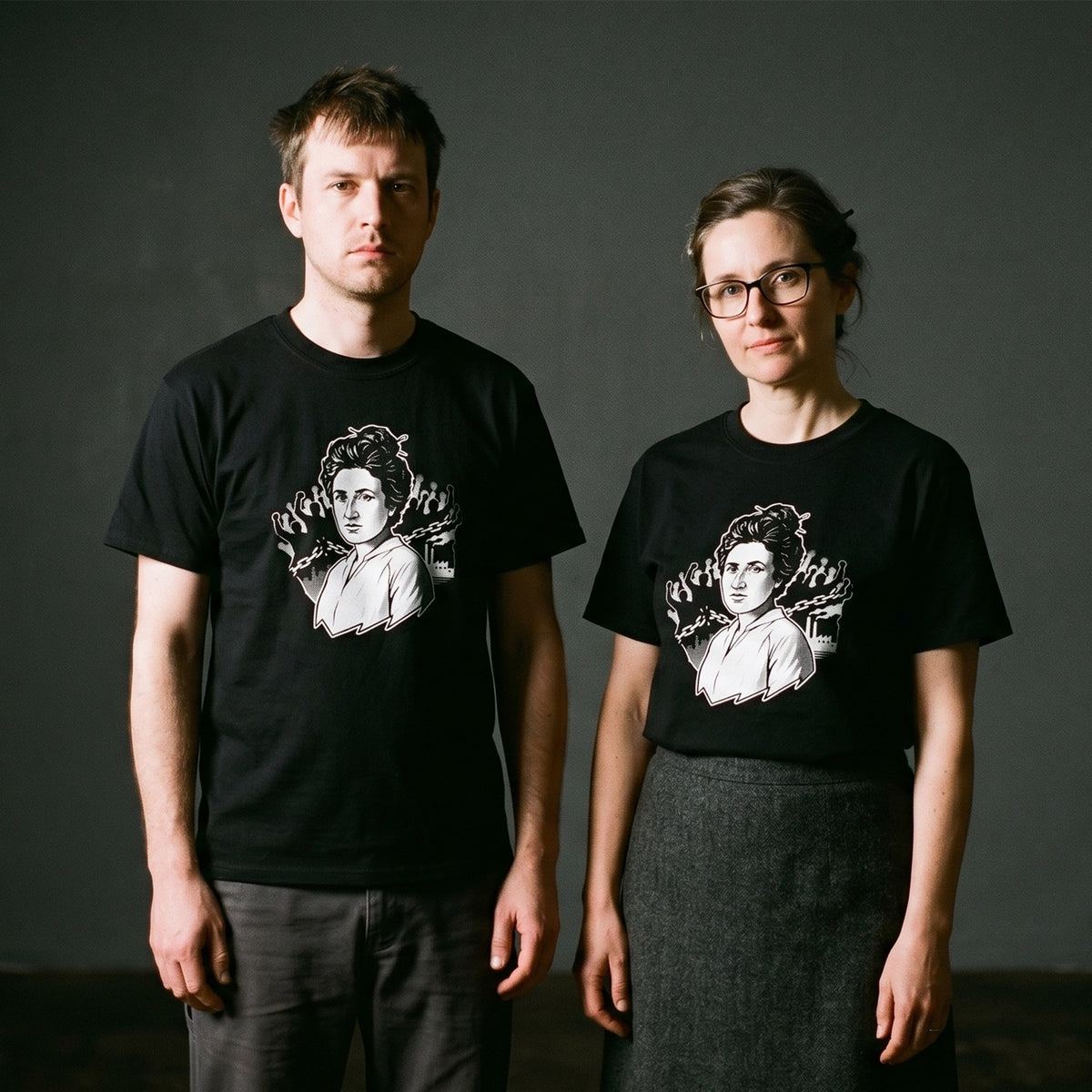 Two models wearing the Rosa Luxemburg black graphic tee