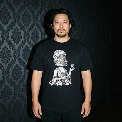 Man wearing the Marie Antoinette black graphic tee