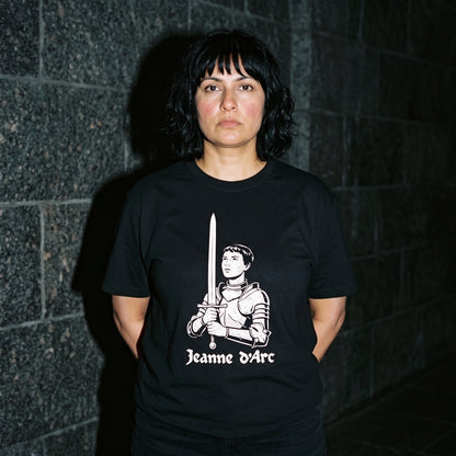 Woman wearing the Jeanne d'Arc black graphic tee