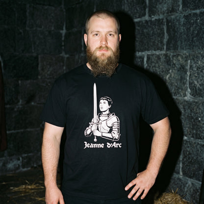 Man wearing the Jeanne d'Arc black graphic tee