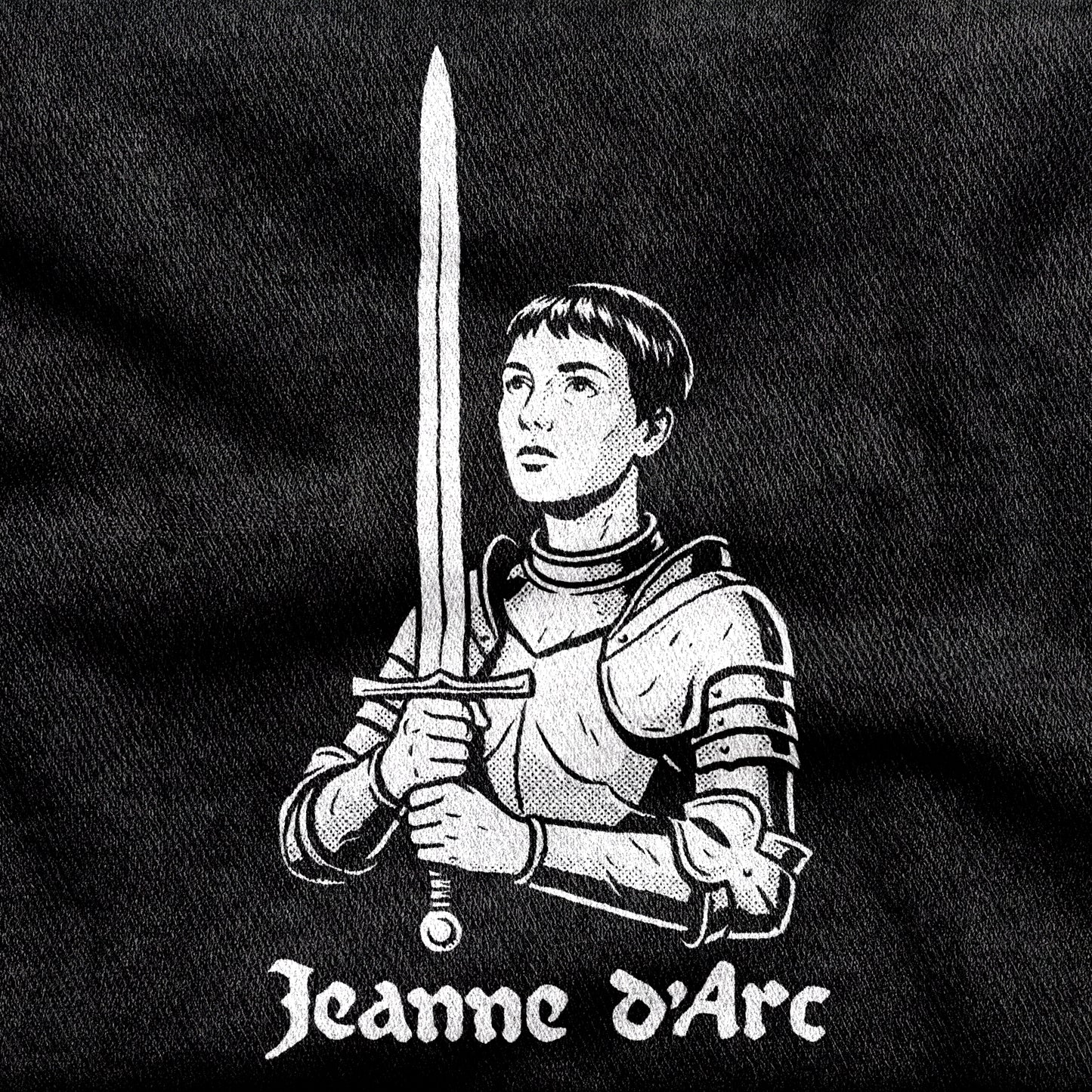 Jeanne d'Arc design printed on a black cotton tee, close-up