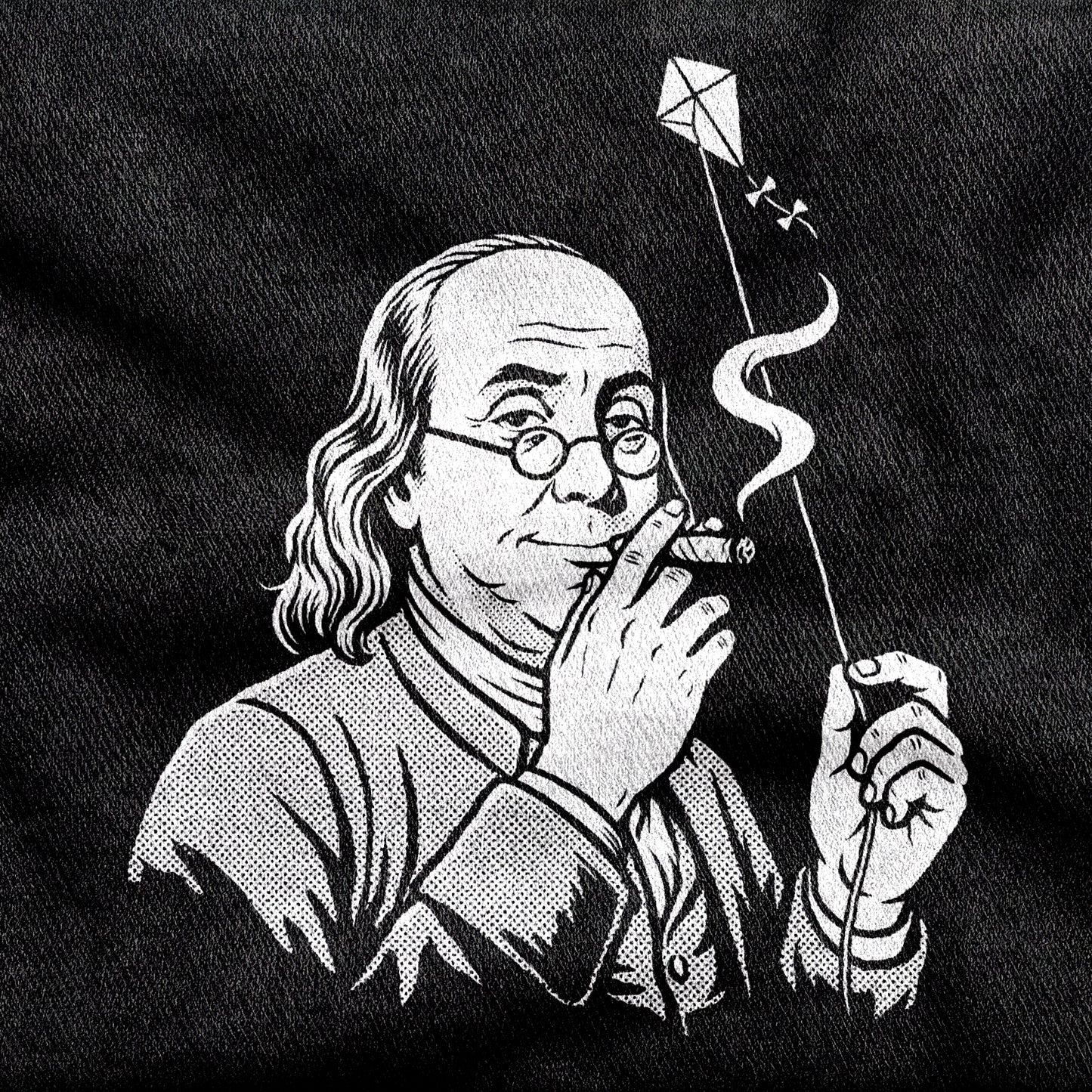 Benjamin Franklin High as a Kite design printed on a black cotton tee, close-up
