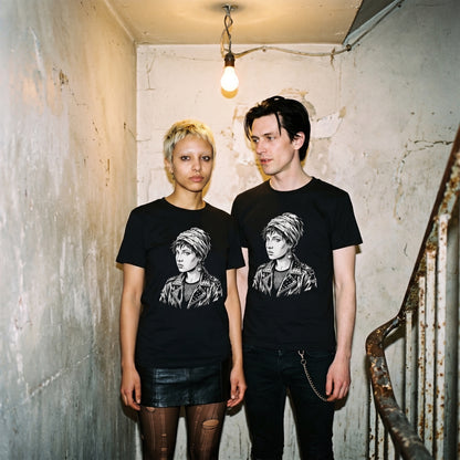 Two models wearing the Girl with a Pearl Earring black graphic tee