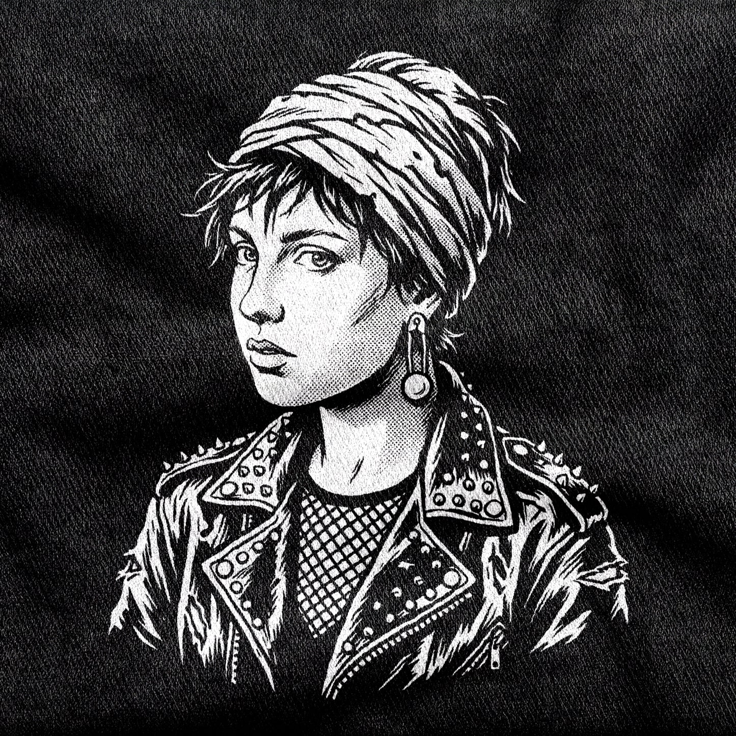 Girl with a Pearl Earring design printed on a black cotton tee, close-up