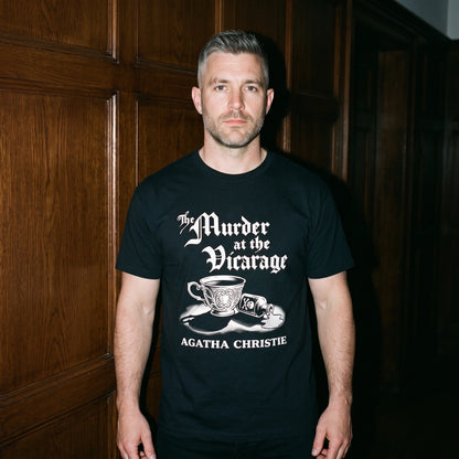 Man wearing the Murder at the Vicarage Agatha Christie black graphic tee