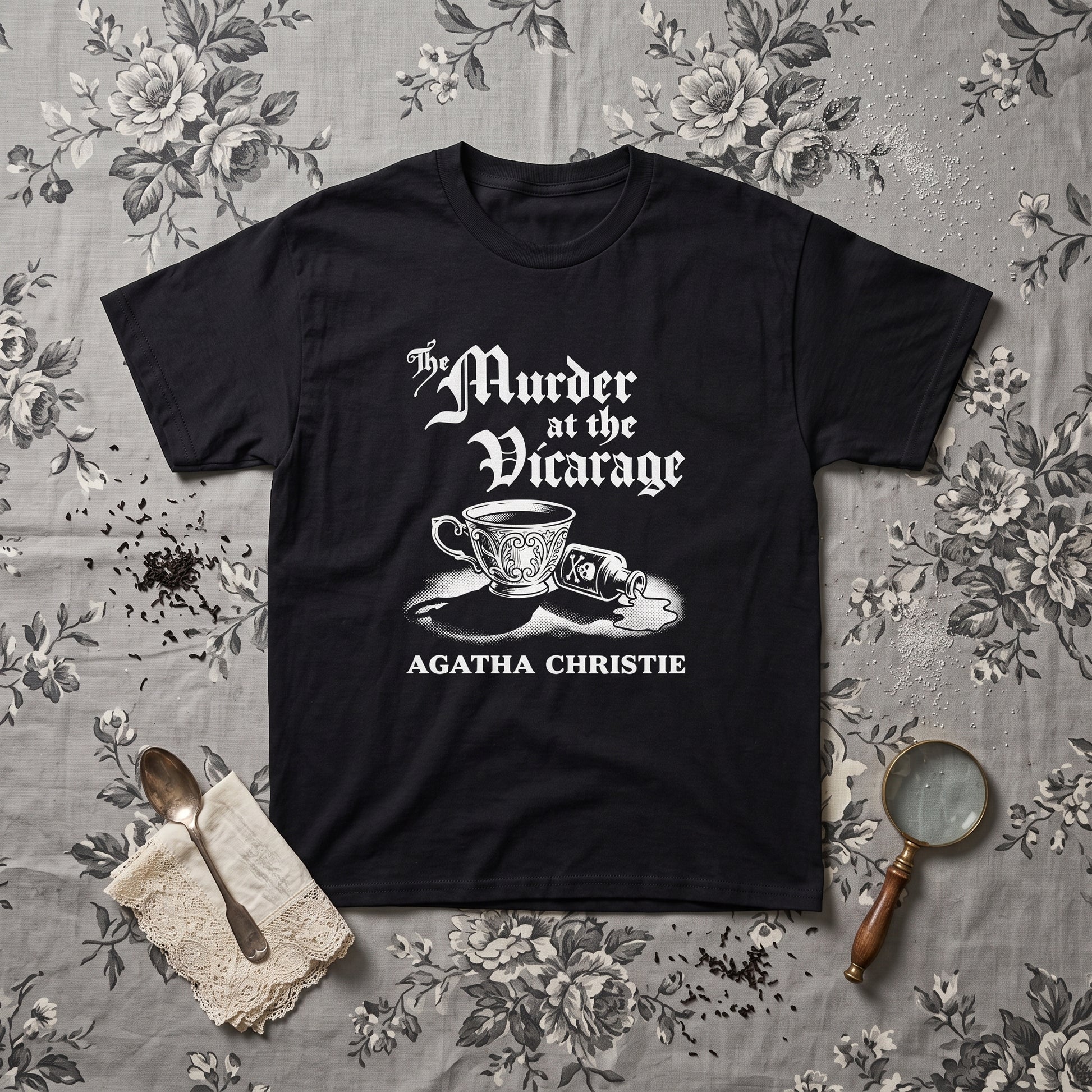 Murder at the Vicarage Agatha Christie black graphic tee, styled flat lay