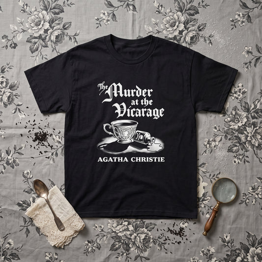 Murder at the Vicarage Agatha Christie black graphic tee, styled flat lay
