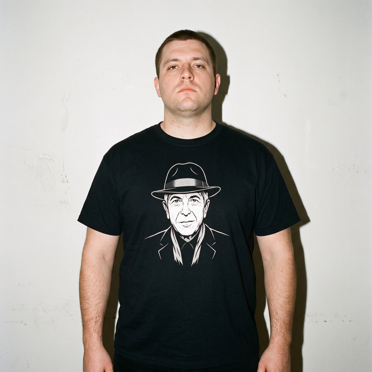 Man wearing the Leonard Cohen black graphic tee