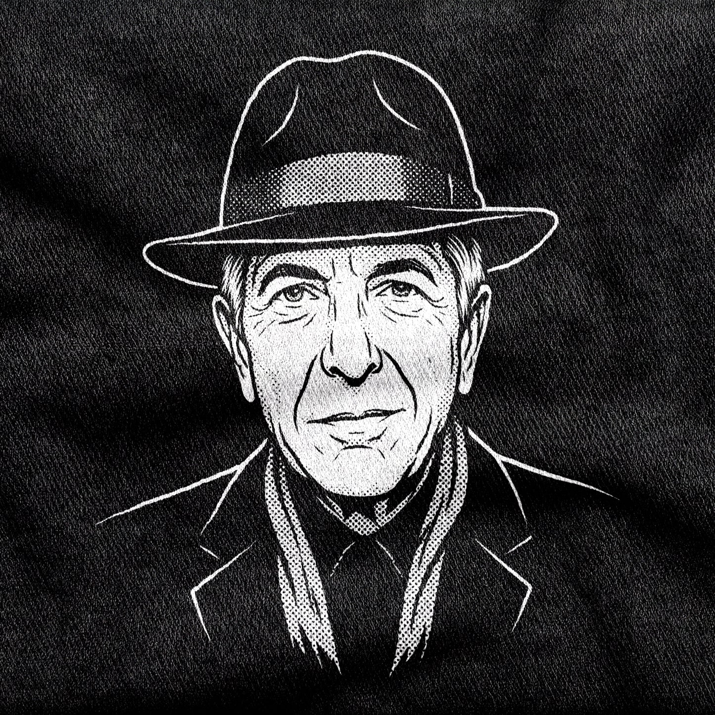 Leonard Cohen design printed on a black cotton tee, close-up