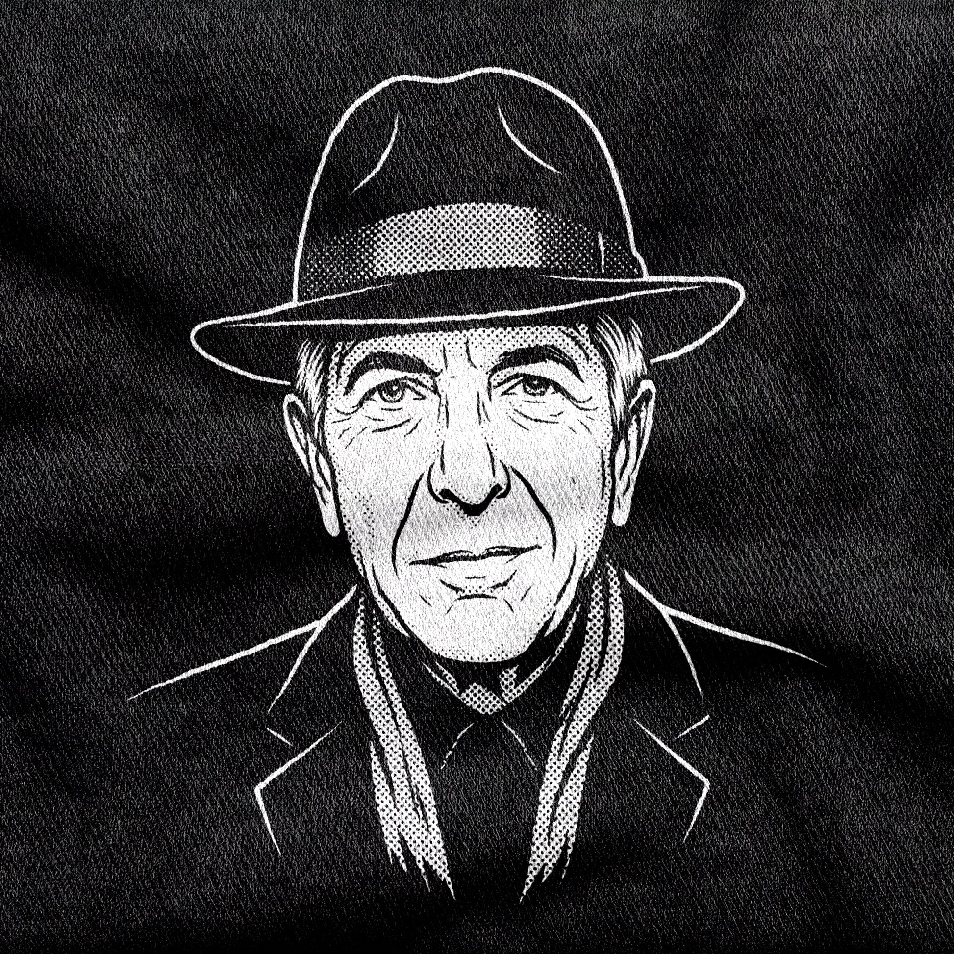 Leonard Cohen design printed on a black cotton tee, close-up