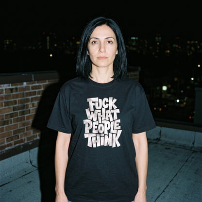 Woman wearing the Fuck What People Think black graphic tee