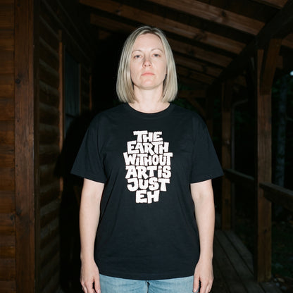 Woman wearing the The Earth Without Art is Just Eh black graphic tee