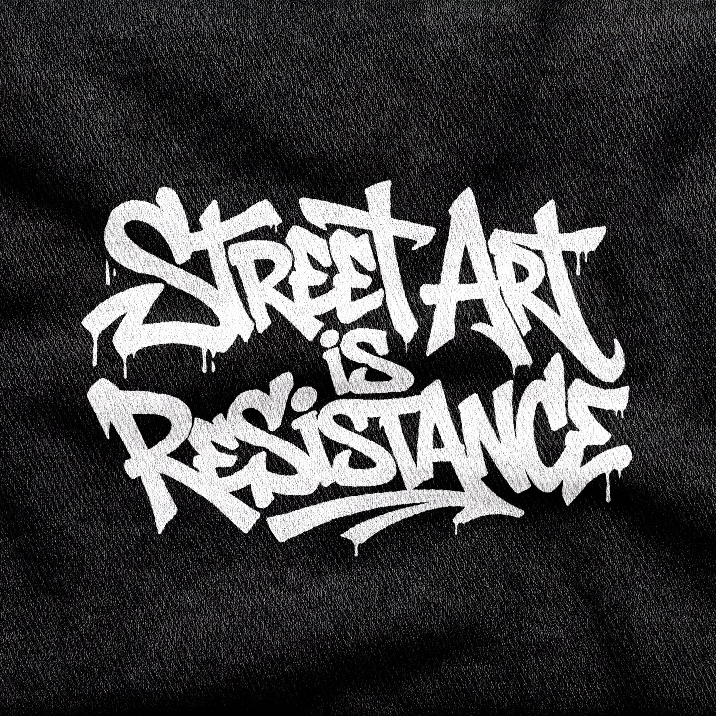 Street Art is Resistance design printed on a black cotton tee, close-up