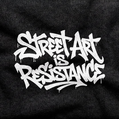 Street Art is Resistance design printed on a black cotton tee, close-up