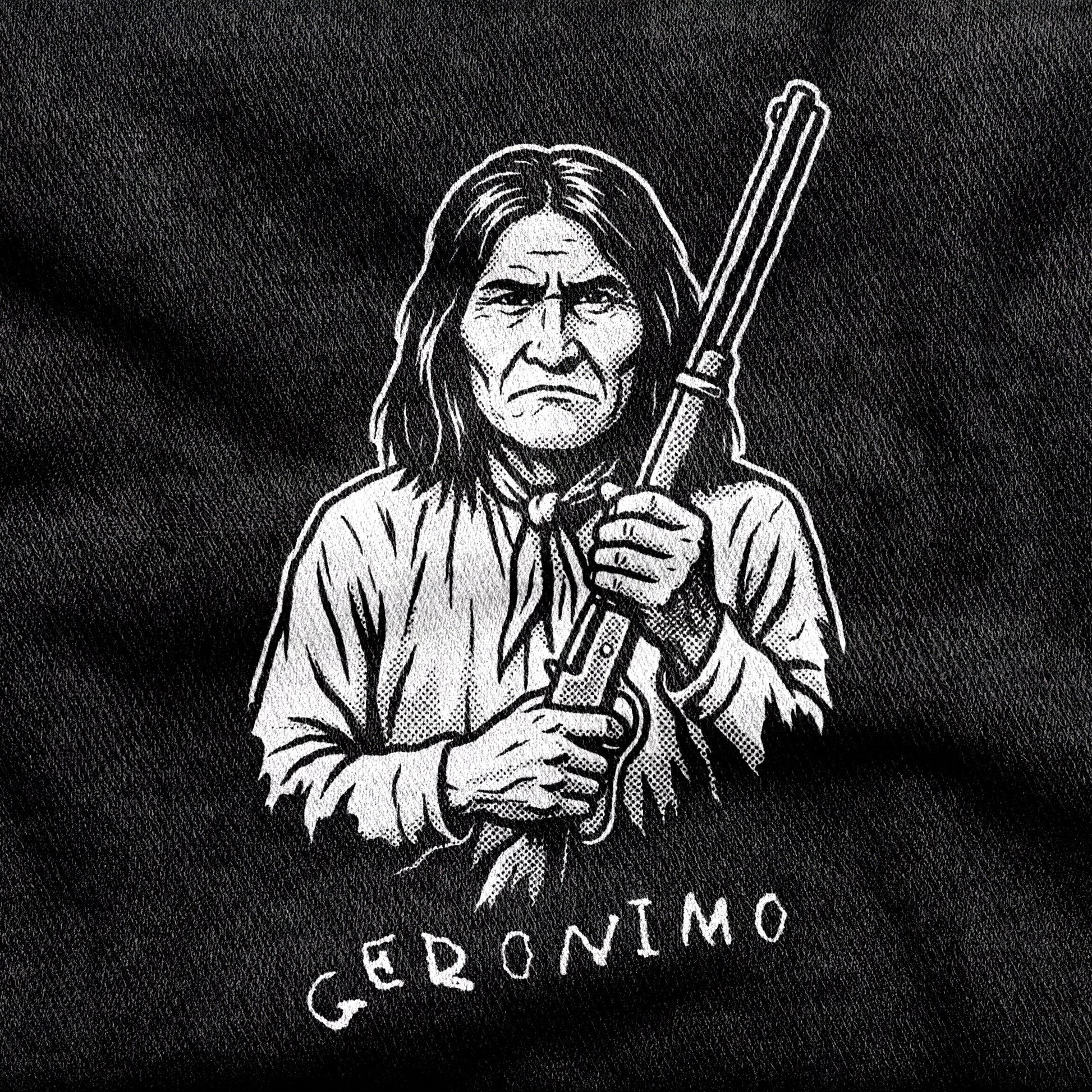 Geronimo design printed on a black cotton tee, close-up