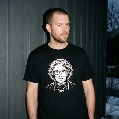 Man wearing the Margaret Atwood black graphic tee