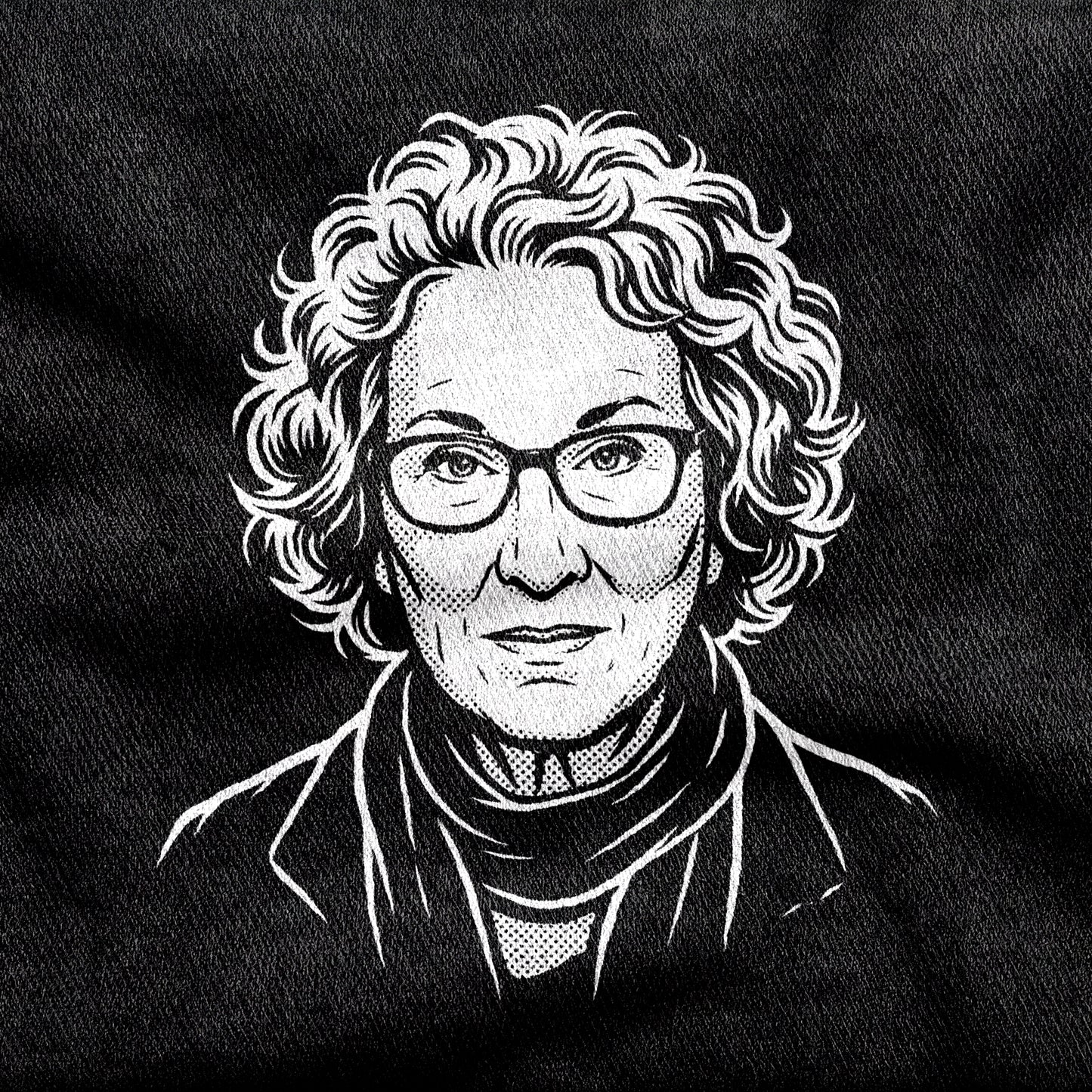 Margaret Atwood design printed on a black cotton tee, close-up