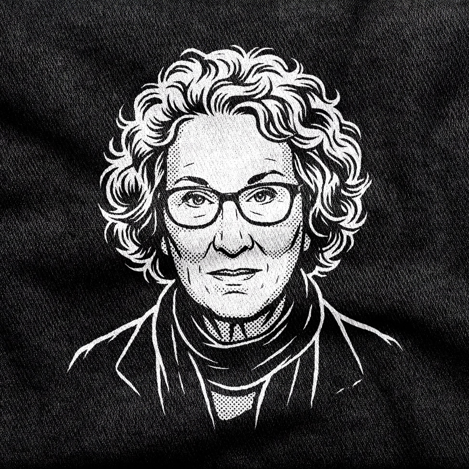 Margaret Atwood design printed on a black cotton tee, close-up