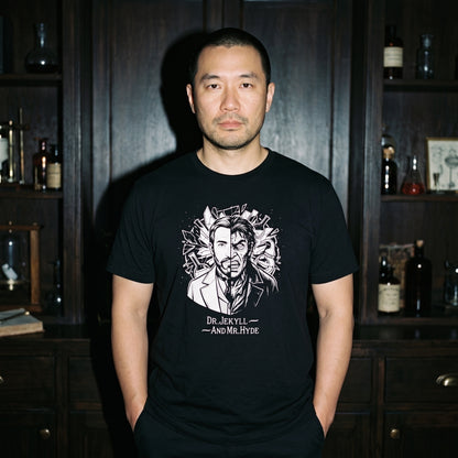 Man wearing the Dr. Jekyll and Mr. Hyde black graphic tee