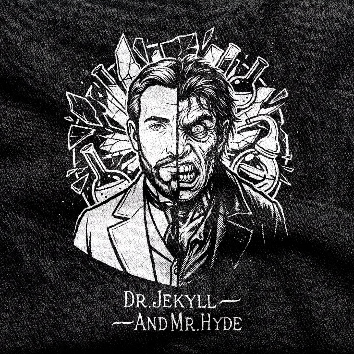 Dr. Jekyll and Mr. Hyde design printed on a black cotton tee, close-up