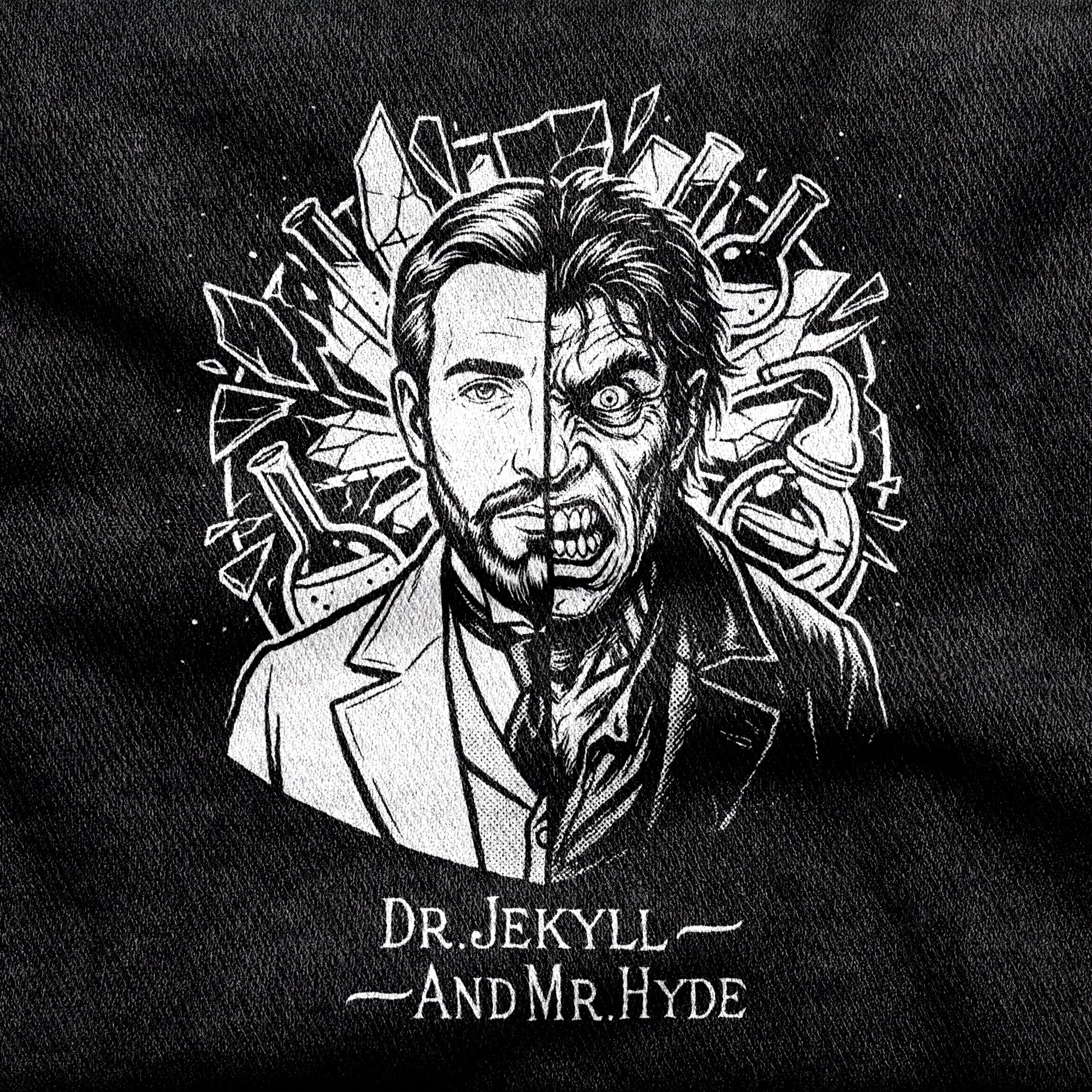 Dr. Jekyll and Mr. Hyde design printed on a black cotton tee, close-up