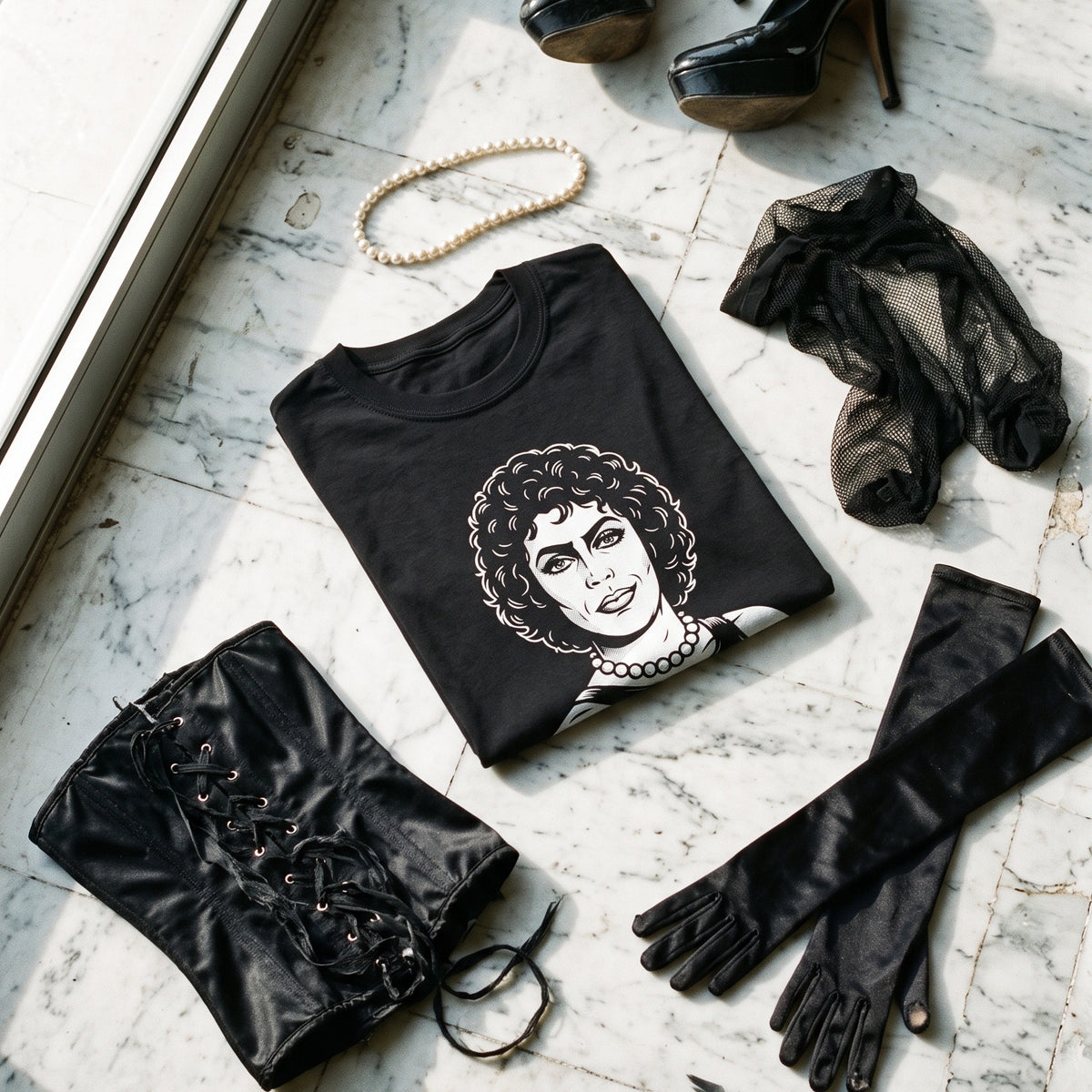 Frank-N-Furter black graphic tee styled in a flat lay with matching pieces