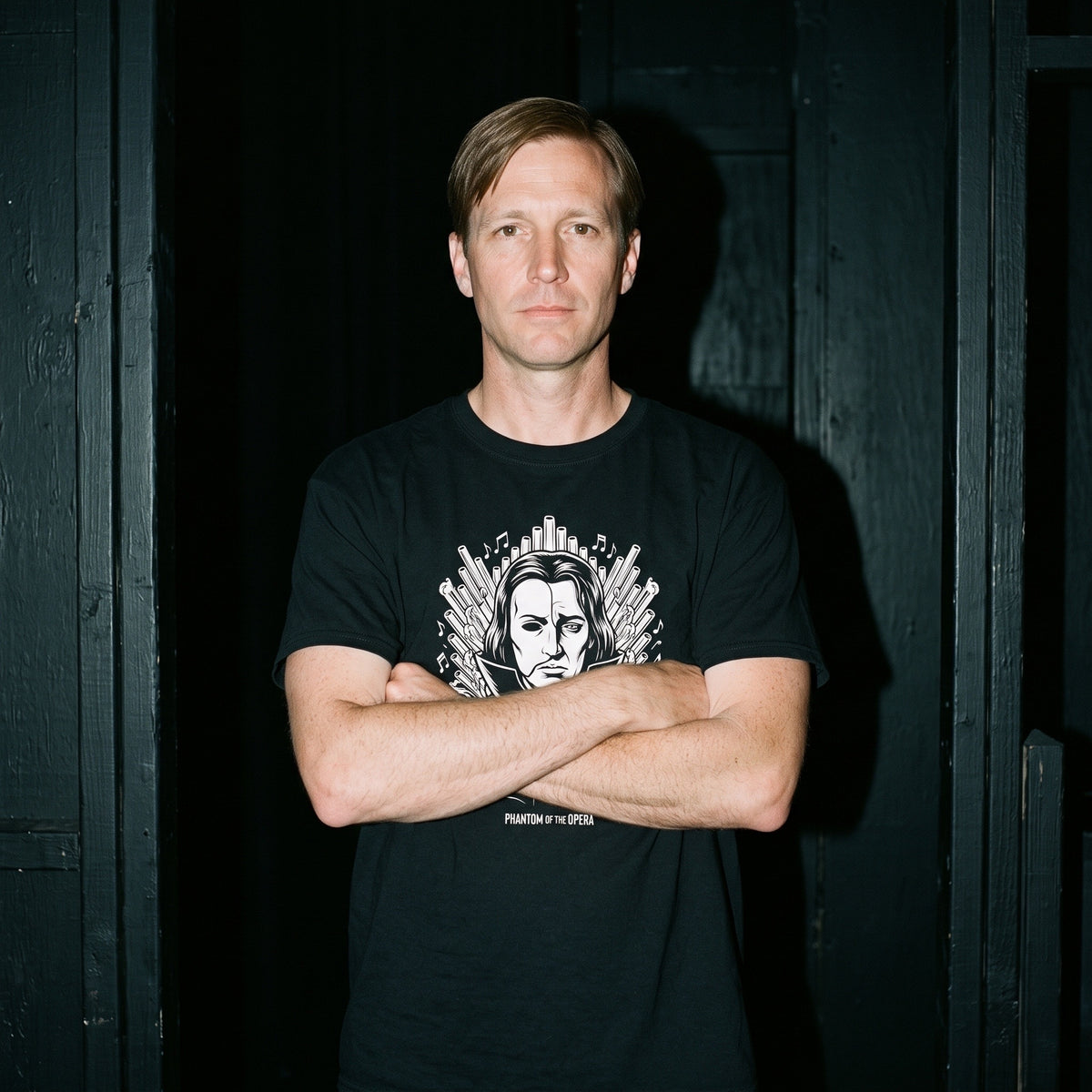 Man wearing the Phantom of the Opera black graphic tee