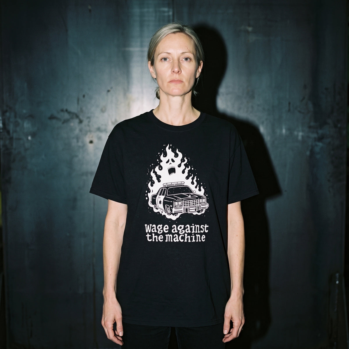 Woman wearing the Wage Against the Machine black graphic tee