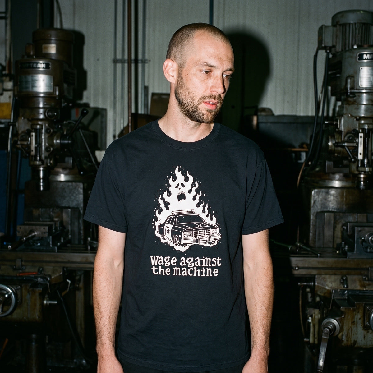 Man wearing the Wage Against the Machine black graphic tee