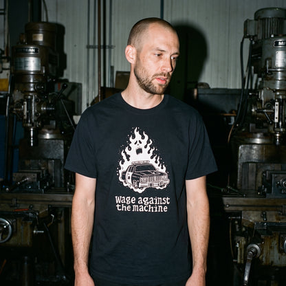 Man wearing the Wage Against the Machine black graphic tee