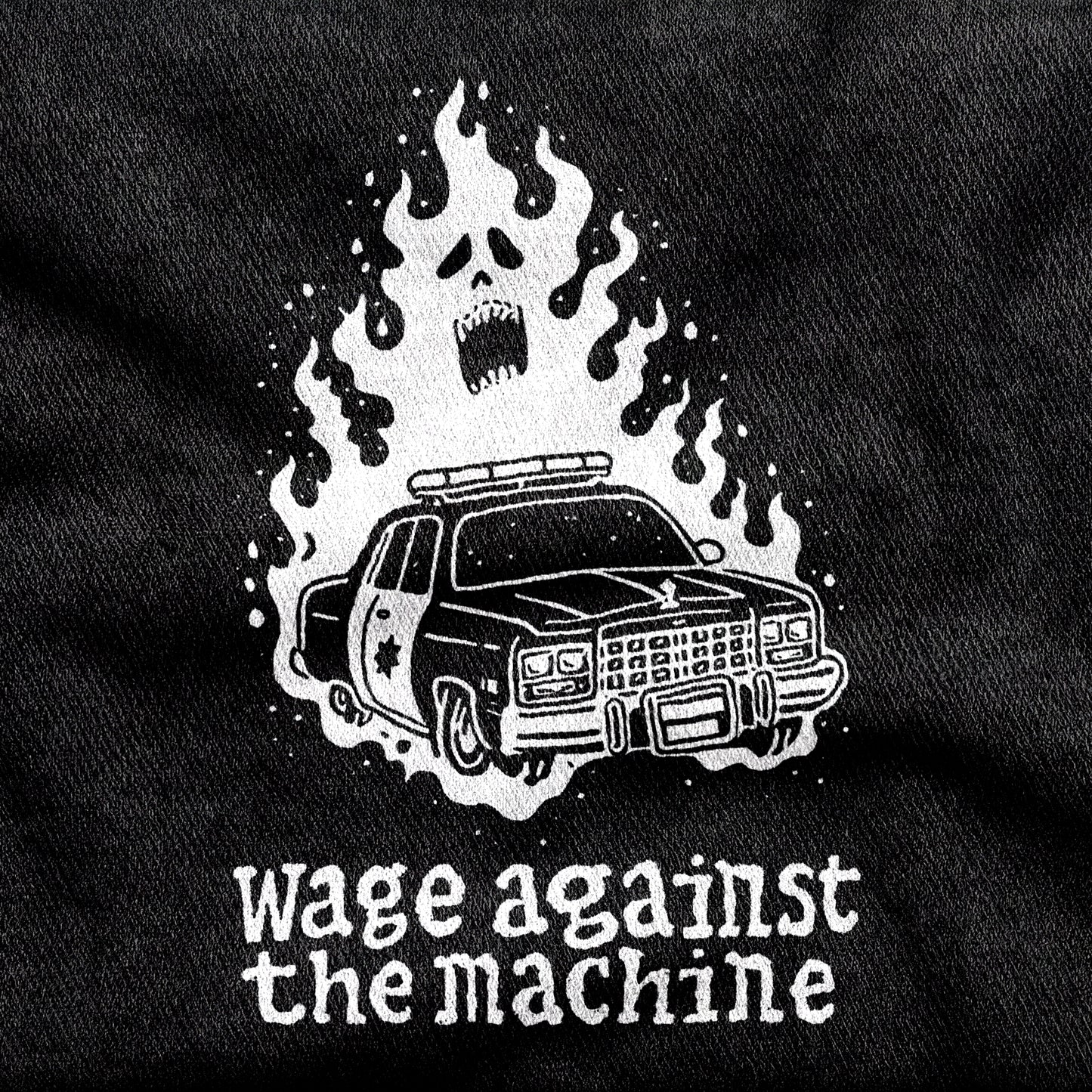 Wage Against the Machine design printed on a black cotton tee, close-up