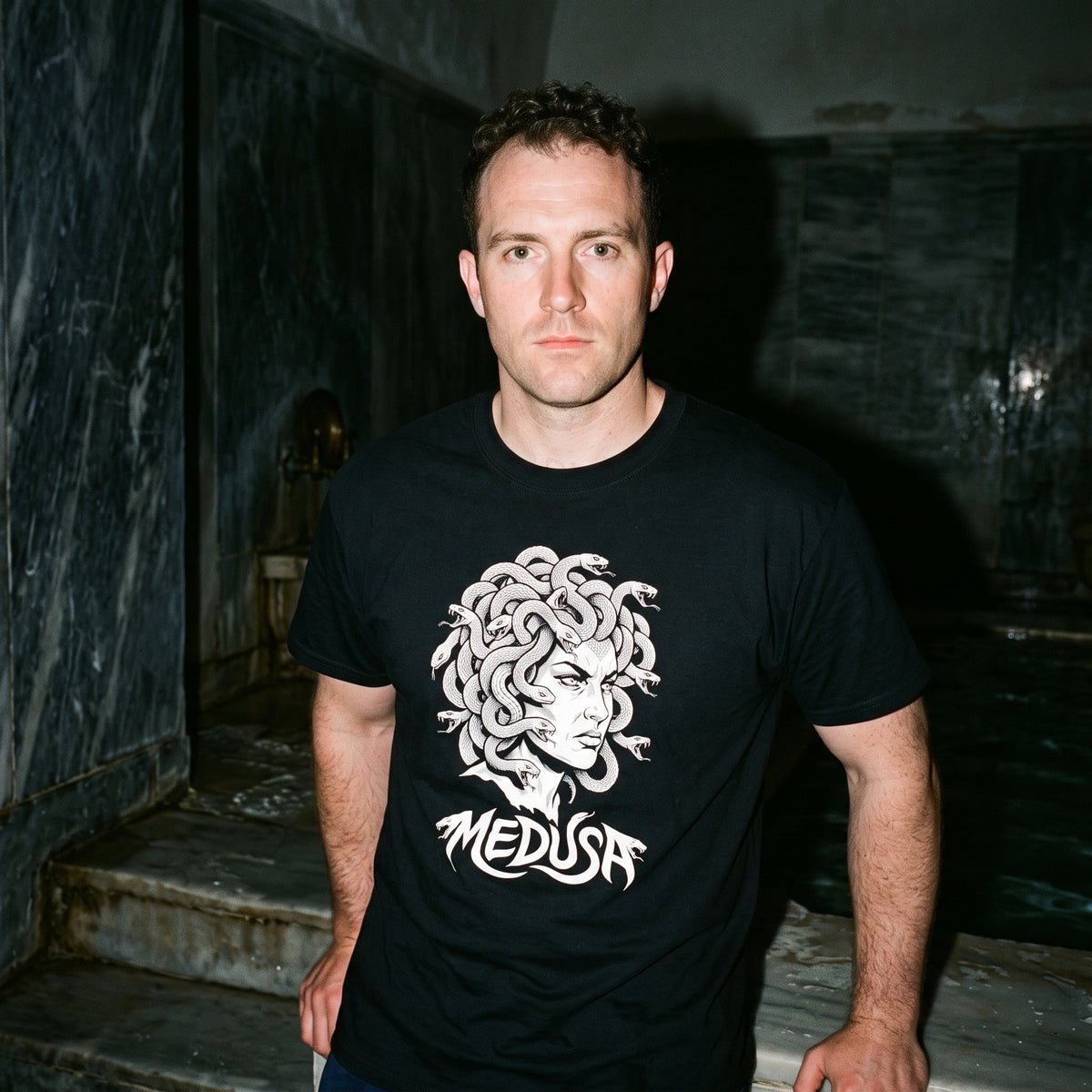 Man wearing the Medusa black graphic tee