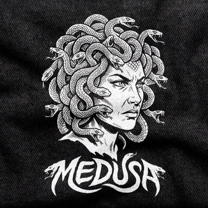 Medusa design printed on a black cotton tee, close-up