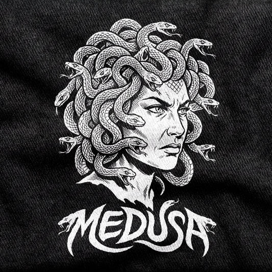 Medusa design printed on a black cotton tee, close-up