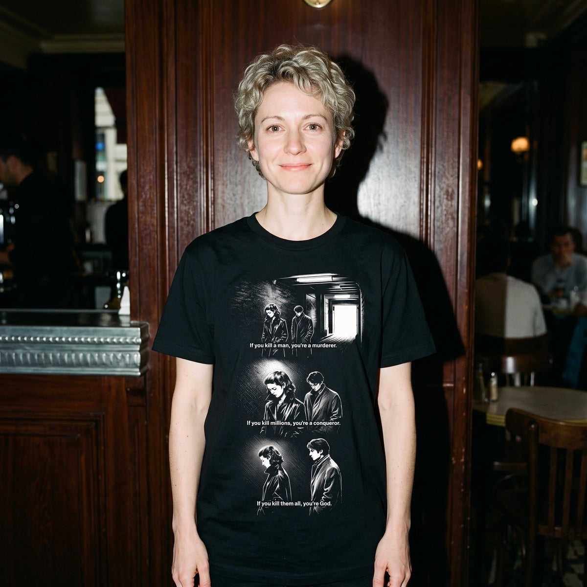 Woman wearing the Masculin Féminin black graphic tee