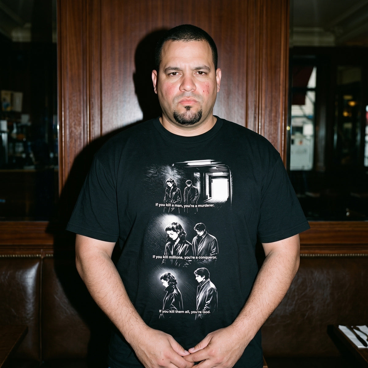 Man wearing the Masculin Féminin black graphic tee