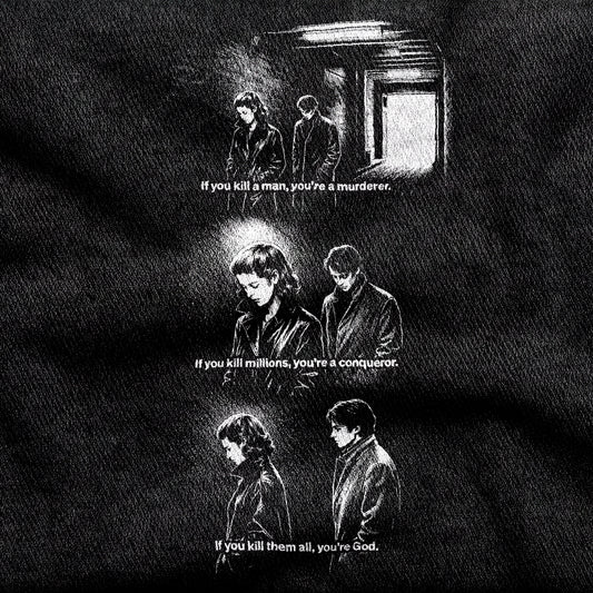 Masculin Féminin design printed on a black cotton tee, close-up