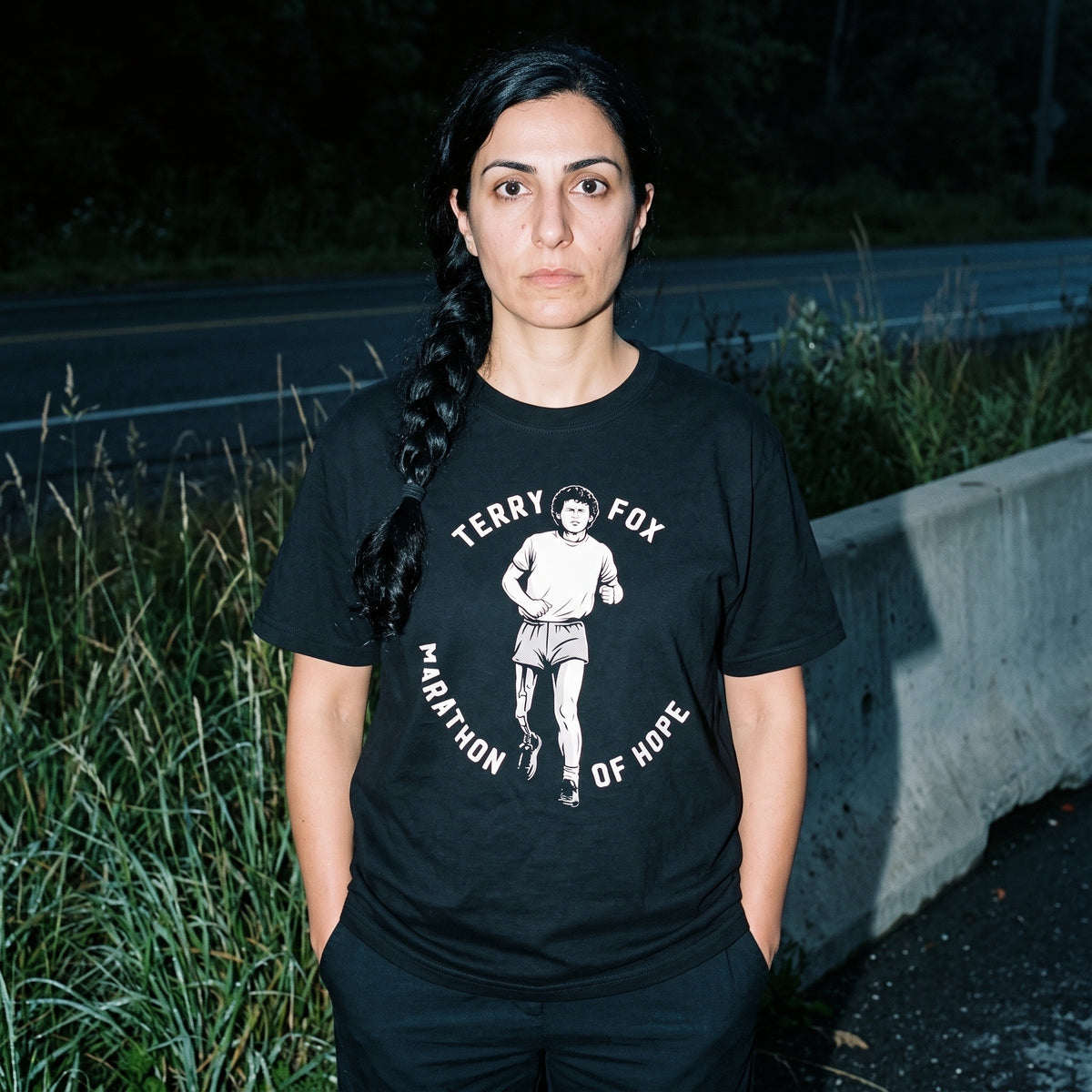Woman wearing the Terry Fox Marathon of Hope black graphic tee
