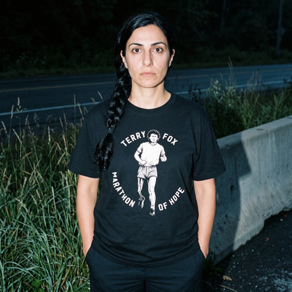 Woman wearing the Terry Fox Marathon of Hope black graphic tee