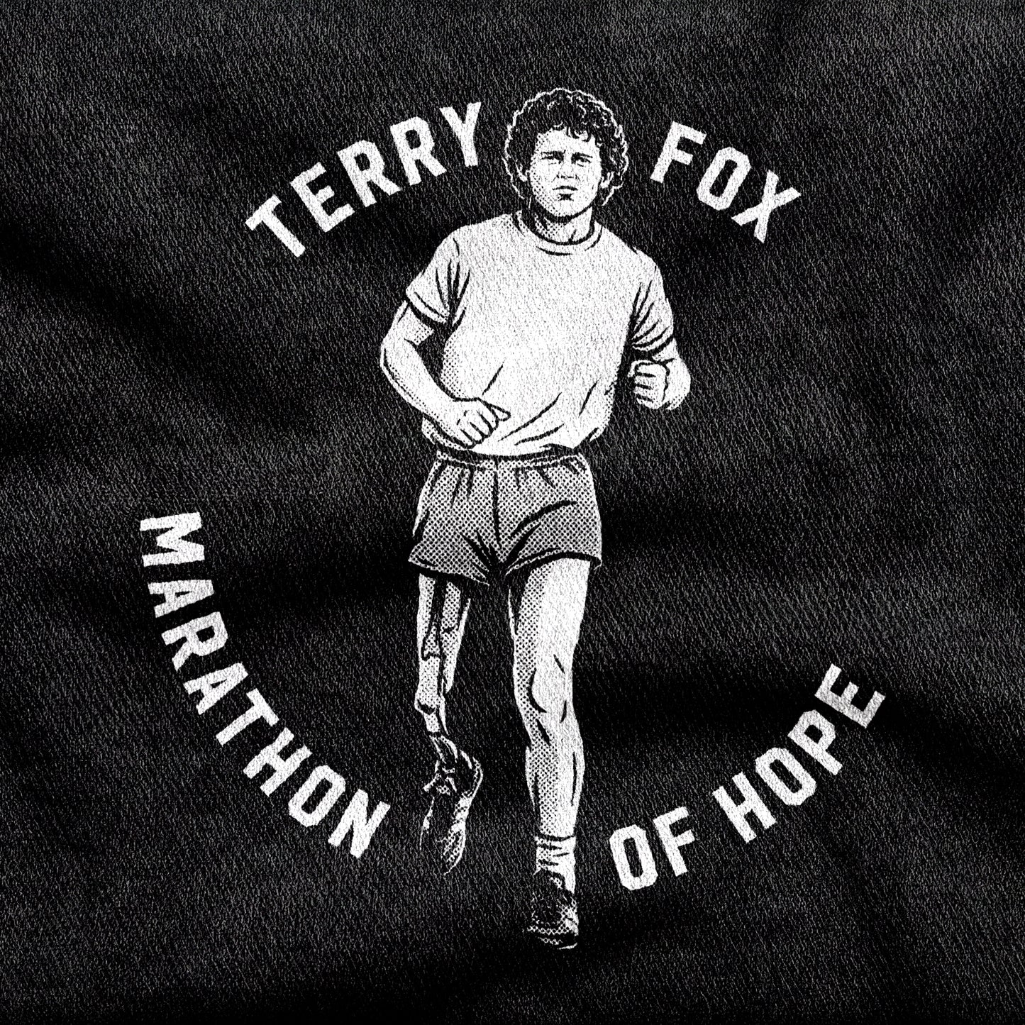 Terry Fox Marathon of Hope design printed on a black cotton tee, close-up