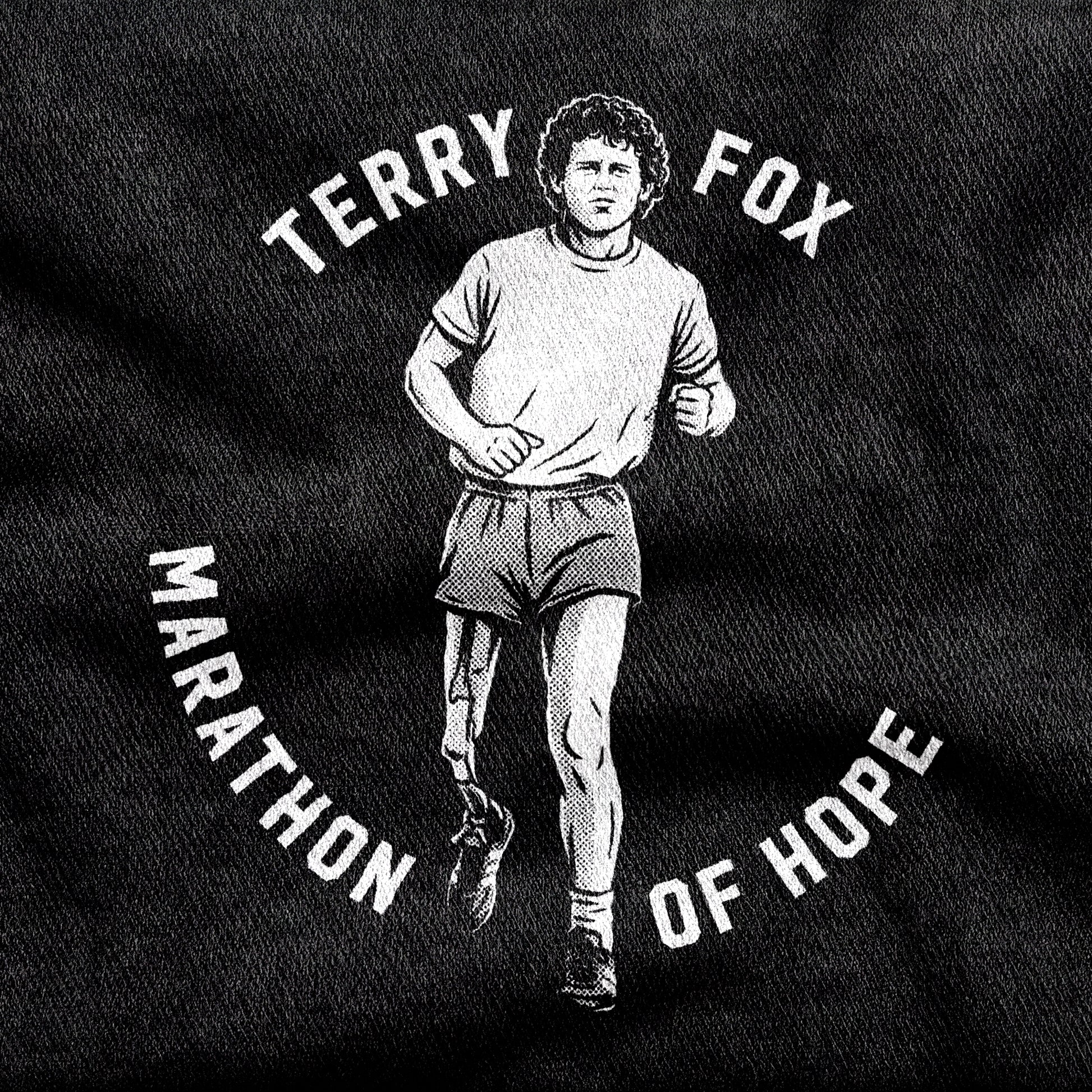 Terry Fox Marathon of Hope design printed on a black cotton tee, close-up